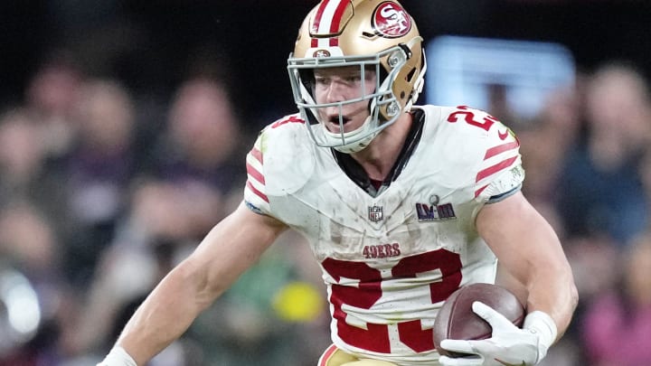 Feb 11, 2024; Paradise, Nevada, USA; San Francisco 49ers running back Christian McCaffrey (23) runs with the ball against the Kansas City Chiefs during overtime of Super Bowl LVIII at Allegiant Stadium. Mandatory Credit: Kirby Lee-USA TODAY Sports