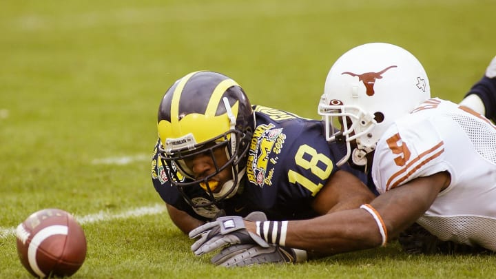 Jan 1, 2005; Pasadena, CA, USA: FILE PHOTO; Michigan Wolverines wide receiver Jermaine Gonzales (18) in action against Texas Longhorns cornerback Tarell Brown (5) during the 2005 Rose Bowl at the Rose Bowl. The Longhorns defeated the Wolverines 38-37. Mandatory Credit: Richard Mackson-USA TODAY Network