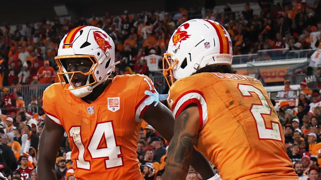 Tampa Bay Buccaneers wide receiver Chris Godwin Jr. (14) celebrates with wide receiver Emeka Egbuka (2) Tampa Bay Buccaneers wide receiver Chris Godwin Jr. (14) celebrates with wide receiver Emeka Egbuka (2)