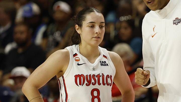 May 10, 2026; Washington, District of Columbia, USA; Washington Mystics guard Georgia Amoore (8) talks with Mystics head coach Sydney Johnson (R) during a stoppage in play against the New York Liberty in the first half at CareFirst Arena. Mandatory Credit: Geoff Burke-Imagn Images