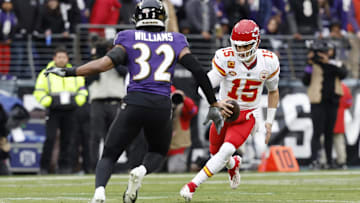 Jan 28, 2024; Baltimore, Maryland, USA; Kansas City Chiefs quarterback Patrick Mahomes (15) runs with the ball as Baltimore Ravens safety Marcus Williams (32) defends in the AFC Championship football game at M&T Bank Stadium. Mandatory Credit: Geoff Burke-Imagn Images