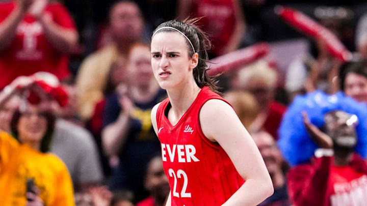 Indiana Fever guard Caitlin Clark reacts to scoring a 3-pointer Saturday, May 17, 2025, during a game against the Chicago Sky at Gainbridge Fieldhouse in Indianapolis.