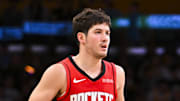 Apr 11, 2025; Los Angeles, California, USA; Houston Rockets guard Reed Sheppard (15) moves the ball against the Los Angeles Lakers during the second half at Crypto.com Arena. Mandatory Credit: Jonathan Hui-Imagn Images