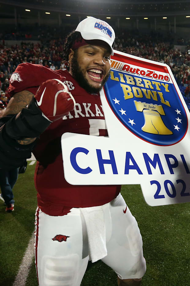 Arkansas Razorbacks defensive linemen Cameron Ball (5) reacts after defeating the Texas Tech Red Raiders.