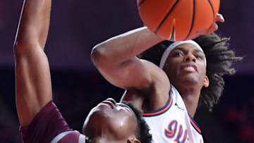 Nov 25, 2024; Champaign, Illinois, USA; Illinois Fighting Illini forward Carey Booth (0) blocks the shot of Little Rock Trojans guard Isaiah Lewis (3) during the second half at State Farm Center. Mandatory Credit: Ron Johnson-Imagn Images