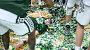 Michigan State's Carson Cooper does a confetti angel while celebrating the Spartans Big Ten championship after the game against Michigan on Sunday, March 9, 2025, at the Breslin Center in East Lansing.
