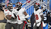 Dec 1, 2024; Charlotte, North Carolina, USA; Tampa Bay Buccaneers offensive tackle Tristan Wirfs (78) celebrates a score by running back Rachaad White (1) during the second half against the Carolina Panthers at Bank of America Stadium. Mandatory Credit: Jim Dedmon-Imagn Images