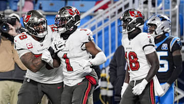 Dec 1, 2024; Charlotte, North Carolina, USA; Tampa Bay Buccaneers offensive tackle Tristan Wirfs (78) celebrates a score by running back Rachaad White (1) during the second half against the Carolina Panthers at Bank of America Stadium. Mandatory Credit: Jim Dedmon-Imagn Images