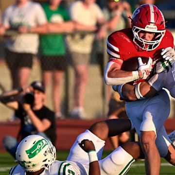 Wall linebacker Jacob Braden tackles Jim Ned running back Aiden Ellis.