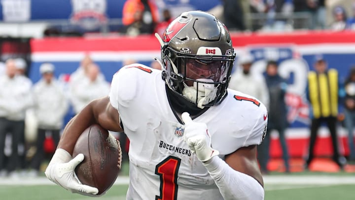 Nov 24, 2024; East Rutherford, New Jersey, USA; Tampa Bay Buccaneers running back Rachaad White (1) scores a rushing touchdown during the second half against the New York Giants at MetLife Stadium. Mandatory Credit: Vincent Carchietta-Imagn Images