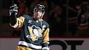 Pittsburgh Penguins center Sidney Crosby reacts to being named first star of the game.