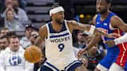 Mar 27, 2024; Minneapolis, Minnesota, USA; Minnesota Timberwolves guard Nickeil Alexander-Walker (9) backs towards the basket as Detroit Pistons forward Chimezie Metu (5) in the second half at Target Center. Mandatory Credit: Jesse Johnson-Imagn Images