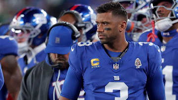 Oct 9, 2025; East Rutherford, New Jersey, USA; New York Giants quarterback Russell Wilson (3) watches from the sidelines during the second quarter against the Philadelphia Eagles at MetLife Stadium. Mandatory Credit: Brad Penner-Imagn Images