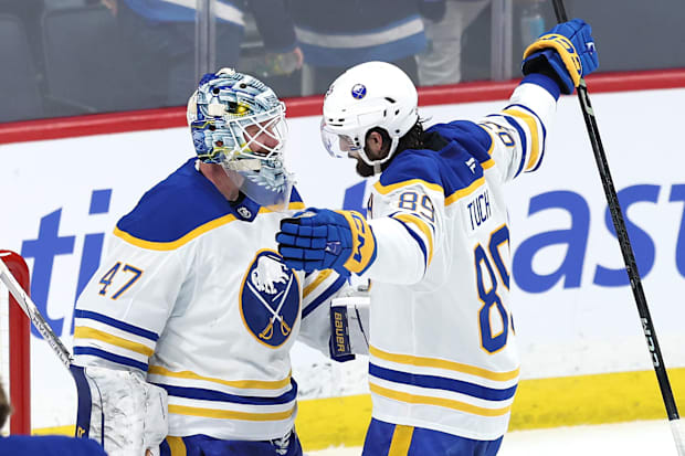 Hockey players celebrate a victor