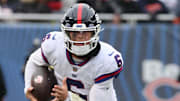Nov 9, 2025; Chicago, Illinois, USA; New York Giants quarterback Jaxson Dart (6) rushes the ball against the Chicago Bears during the second half at Soldier Field.  