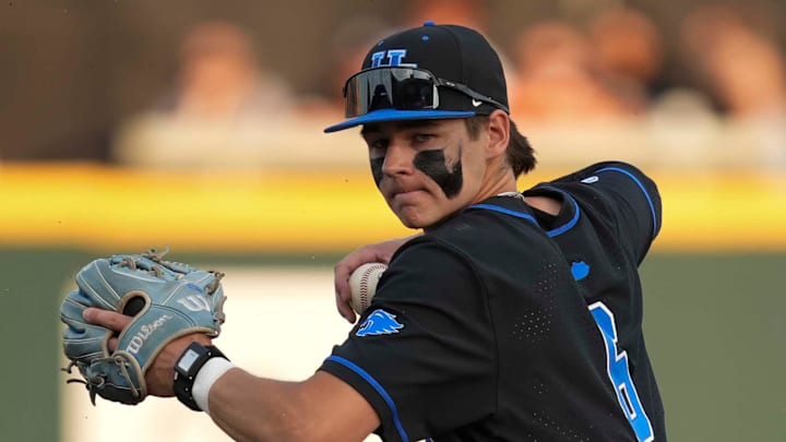 Kentucky infielder Tyler Bell (6) throws the ball to first base after getting Tennessee infielder Andrew Fischer (11) out at second base during a NCAA baseball game between Tennessee and Kentucky at Lindsey Nelson Stadium in Knoxville, Tenn., on April 18, 2025.