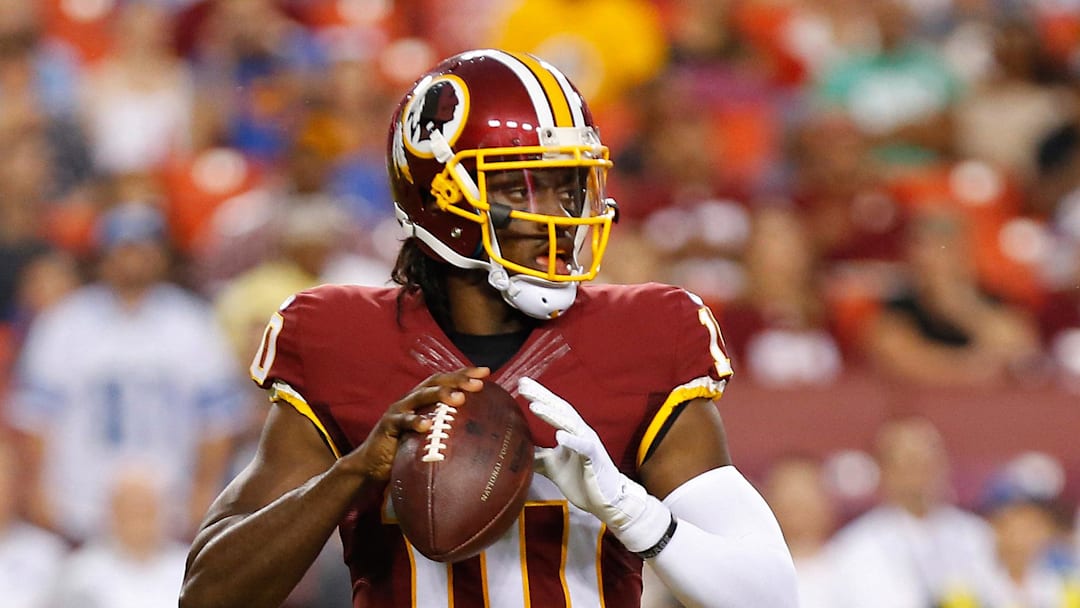 Aug 20, 2015; Landover, MD, USA; Washington Redskins quarterback Robert Griffin III (10) prepares to throw the ball against the Detroit Lions at FedEx Field. Mandatory Credit: Geoff Burke-Imagn Images