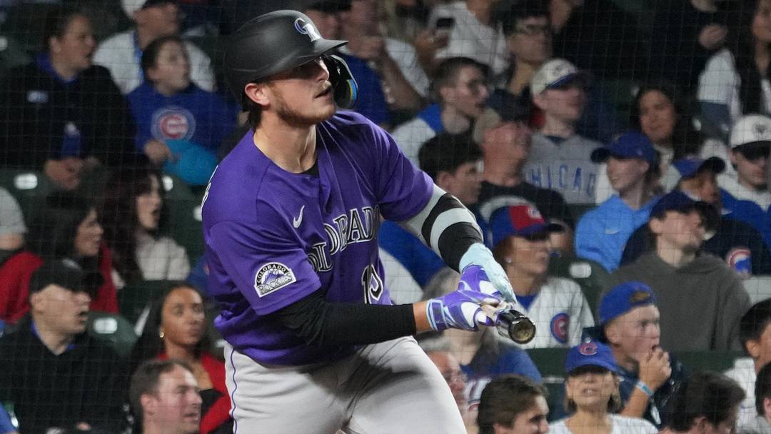 Jun 17, 2026; Chicago, Illinois, USA;  Colorado Rockies catcher Hunter Goodman (15) hits a two-run home run against the Chicago Cubs during the eighth inning at Wrigley Field. Mandatory Credit: David Banks-Imagn Images