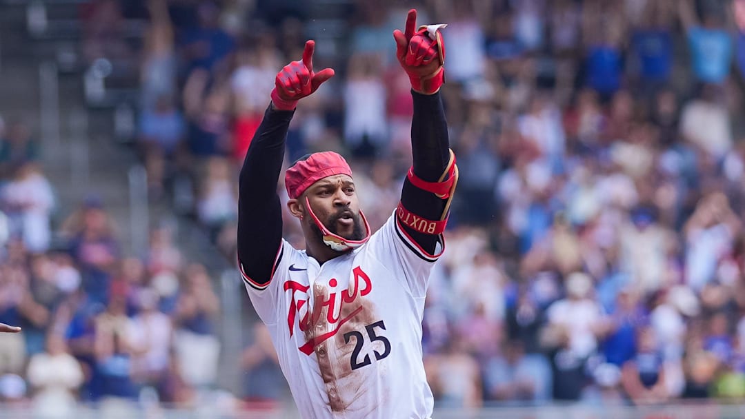 Jul 12, 2025; Minneapolis, Minnesota, USA; Minnesota Twins outfielder Byron Buxton (25) celebrates his triple against the Pittsburgh Pirates in the second inning at Target Field. Mandatory Credit: Brad Rempel-Imagn Images