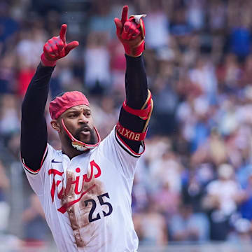 Jul 12, 2025; Minneapolis, Minnesota, USA; Minnesota Twins outfielder Byron Buxton (25) celebrates his triple against the Pittsburgh Pirates in the second inning at Target Field. Mandatory Credit: Brad Rempel-Imagn Images