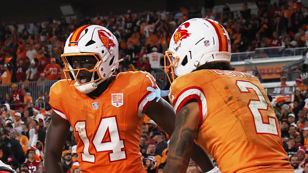 Tampa Bay Buccaneers wide receiver Chris Godwin Jr. (14) celebrates with wide receiver Emeka Egbuka (2) 
