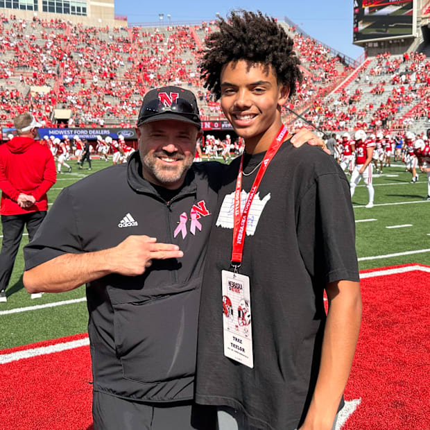 2027 four-star quarterback Trae Taylor with Nebraska football coach Matt Rhule before the 2024 Rutgers game.