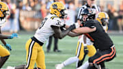 Massillon's Nolan Davenport blocks a Valdosta (Georgia) defender during a game in the 2023 season at Massillon's Paul Brown Tiger Stadium. 