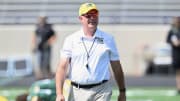 St. Edward football head coach Tom Lombardo watches as his team warms up prior to a game against Our Lady of Good Counsel (Maryland) on August 27, 2023.