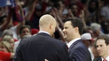 Xavier head coach Chris Mack, left, talks with Arizona head coach Sean Miller after the Wildcats beat the Musketeers during the NCAA Sweet Sixteen at the Staples Center in Los Angeles Thursday. Xavier lost 60-68.  Mack was Miller's assistant coach when Miller was Xavier's head coach. Photo shot Thursday March 26, 2015.

Xavier Arizona13