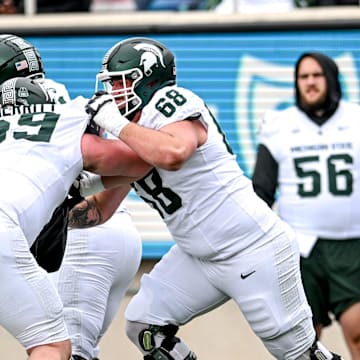 Michigan State's Jacob Merritt, left, and Gavin Broscious run a drill during the Spring Showcase on Saturday, April 20, 2024, at Spartan Stadium in East Lansing.