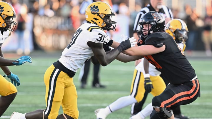 Massillon's Nolan Davenport blocks a Valdosta (Georgia) defender during a game in the 2023 season at Massillon's Paul Brown Tiger Stadium. 