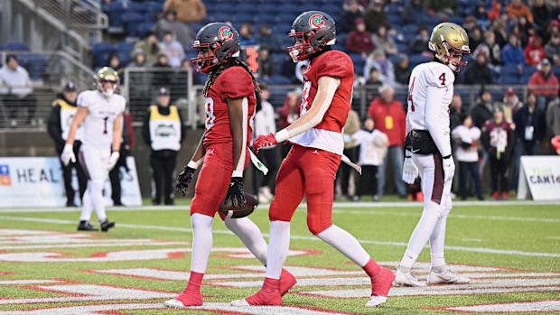 Toledo Central Catholic's Preston Fryzel (front) celebrates with a teammate during the 2023 OHSAA Division I state title game