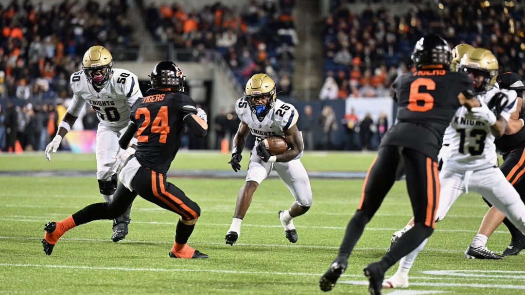 Massillon safety Tyler Hackenbracht prepares to make a tackle against Archbishop Hoban in the 2023 OHSAA Division II state championship game. 