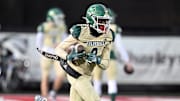 Tairan Davis of Ursuline runs with the ball during a game against  Canfield in 2023. 