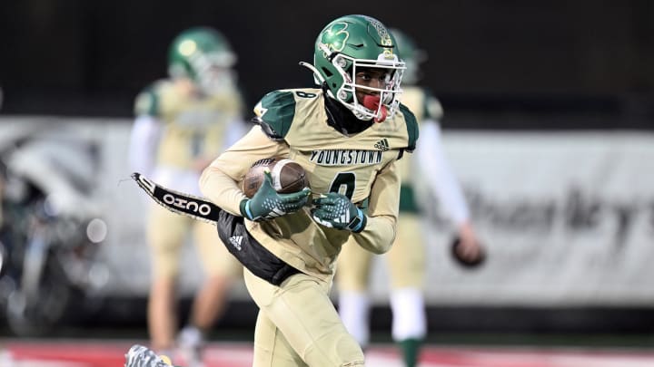 Tairan Davis of Ursuline runs with the ball during a game against  Canfield in 2023. 