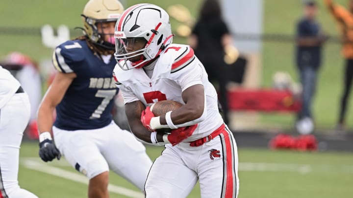 Ziaire Stevens of Akron Wast runs the ball against Archbishop Hoban during a game in the 2023 season. The Purdue commit is one of the top running backs in Ohio in the 2024 season. 