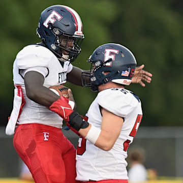 Austintown-Fitch teammates celebrate during a win over Massillon Jackson on August 30, 2023. 