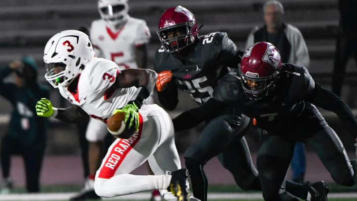 Greenville's Mazeo \"MJ\" Bennett (3) runs the ball for a touchdown during the Upper State playoffs against Westside High on Friday, Nov. 24, 2023.