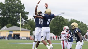 Archbishop Hoban wide receiver Payton Cook (No. 0) celebrates with quarterback Tylan Boykin during a game against Akron East on September 20, 2023.