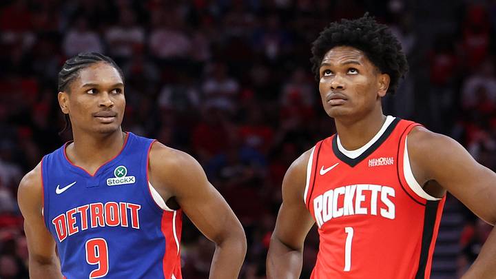 Oct 24, 2025; Houston, Texas, USA; Detroit Pistons guard Ausar Thompson (9) and twin brother Houston Rockets guard Amen Thompson (1) stand on the court during the third quarter at Toyota Center. Mandatory Credit: Troy Taormina-Imagn Images