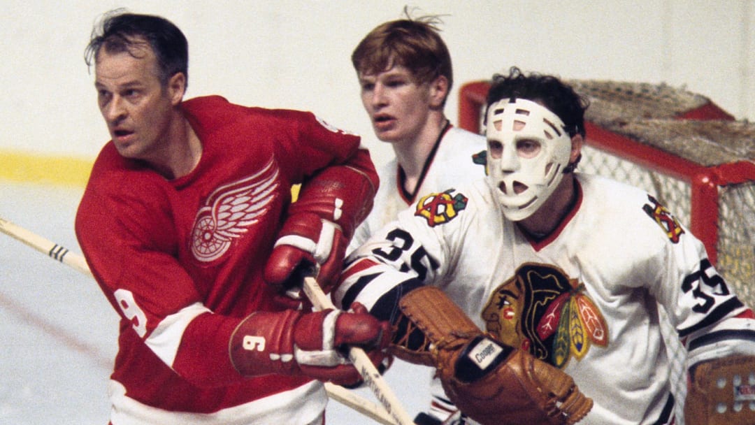 1970; Detroit, MI, USA; FILE PHOTO; Chicago Blackhawks goalie Tony Esposito (35) and defender Keith Magnuson (3) in action against Detroit Red Wings right wing Gordie Howe (9) during the 1970 season. Mandatory Credit: Tony Tomsic-USA TODAY NETWORK