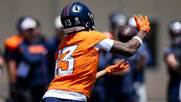Denver Broncos rookie wide receiver Pat Bryant (13) hauls in a pass during mandatory minicamp.