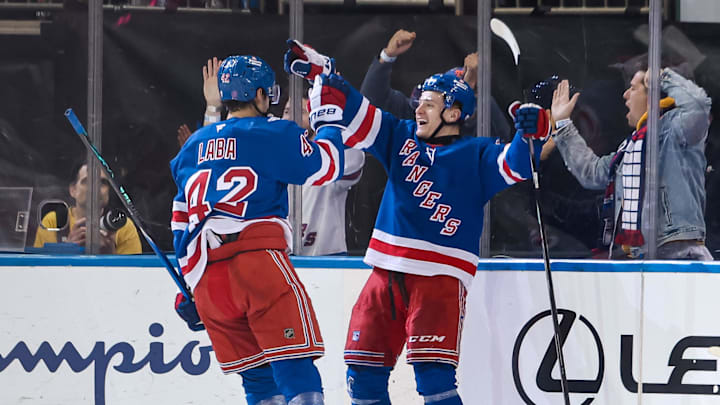 Apr 5, 2026; New York, New York, USA; New York Rangers left wing Adam Sykora (38) celebrates his goal with center Noah Laba (42) during the second period against the Washington Capitals at Madison Square Garden. Apr 5, 2026; New York, New York, USA; New York Rangers left wing Adam Sykora (38) celebrates his goal with center Noah Laba (42) during the second period against the Washington Capitals at Madison Square Garden.