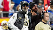 Nov 23, 2024; Kansas City, Missouri, USA; Colorado Buffaloes coach Deion Sanders watches the run of play during the 3rd quarter between the Kansas Jayhawks and the Colorado Buffaloes at GEHA Field at Arrowhead Stadium. 
