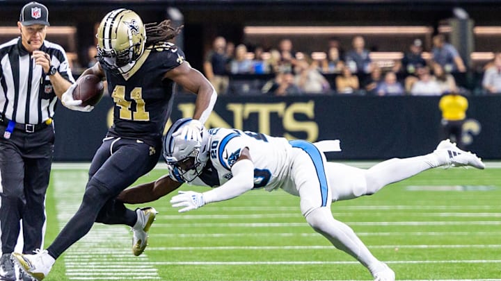 Jordan Fuller and Alvin Kamara