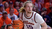 Feb 15, 2025; Champaign, Illinois, USA;  Illinois Fighting Illini forward Jake Davis (15) drives the ball during the second half against the Michigan State Spartans at State Farm Center. Mandatory Credit: Ron Johnson-Imagn Images