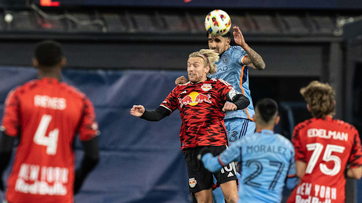 Emil Forsberg (10) of Red Bulls and Thiago Martins (13) of...