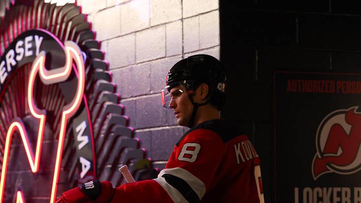 New Jersey Devils defenseman Johnathan Kovacevic (8) walks to the ice before the start of game three of the first round of the 2025 Stanley Cup Playoffs against the Carolina Hurricanes at Prudential Center. Mandatory Credit: Ed Mulholland-Imagn Images