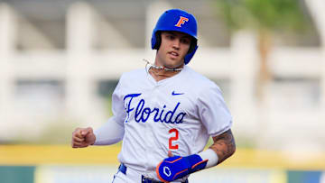 Florida outfielder Ty Evans (2) approaches third base after a home run hit by teammate Florida utility Jac Caglianone (14), not shown, during the first inning of an NCAA baseball matchup at 121 Financial Ballpark in Jacksonville, Fla. Florida State defeated Florida 14-3.