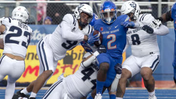 Nov 25, 2022; Boise, Idaho, USA; Boise State Broncos running back Ashton Jeanty (2) breaks through the line during the second half against the Utah State Aggies at Albertsons Stadium. Boise State defeats Utah State 42-23. Mandatory Credit: Brian Losness-USA TODAY Sports